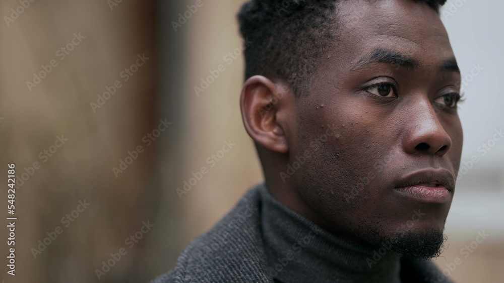 Pensive man thinking outdoors. Thoughtful portrait face close-up