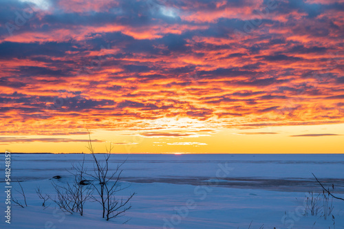 Sunset over the frozen sea. F  boda  Finland.