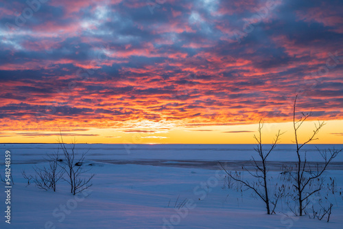 Sunset over the frozen sea. Fäboda, Finland.
