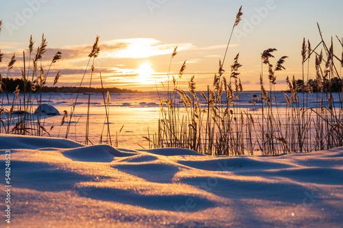 Sunset over the frozen sea. Fäboda, Finland.