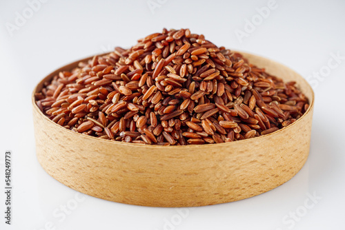 raw fresh red rice on a white background