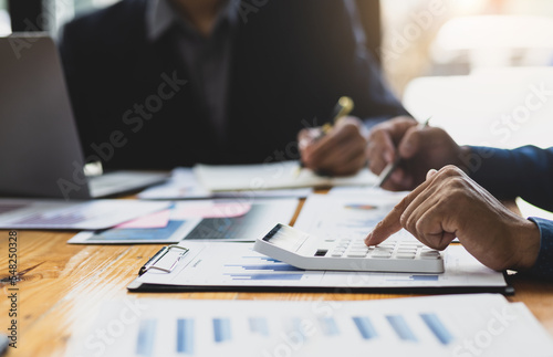 Businessman meeting and working with financial report for analysis data figures to plan business strategies. Financial, Accounting and Investment Analysis