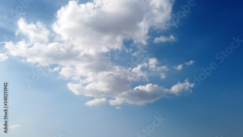 White fluffy and beautiful cumulus clouds like a cotton  freedom tranform small to big shape on blue sky  in daytime beauty in  nature top view tropical  time lapse