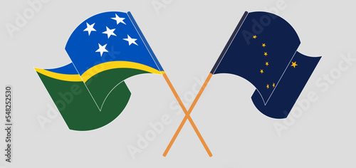 Crossed and waving flags of Solomon Islands and the State of Alaska
