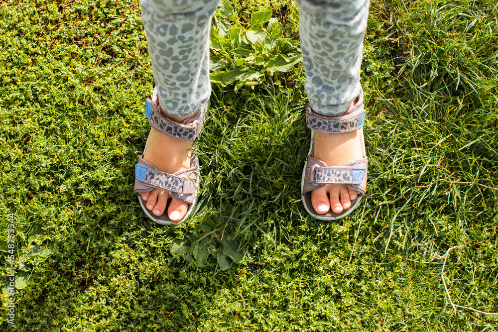 Crop kids feet in sandals Crop kids feet in sandals