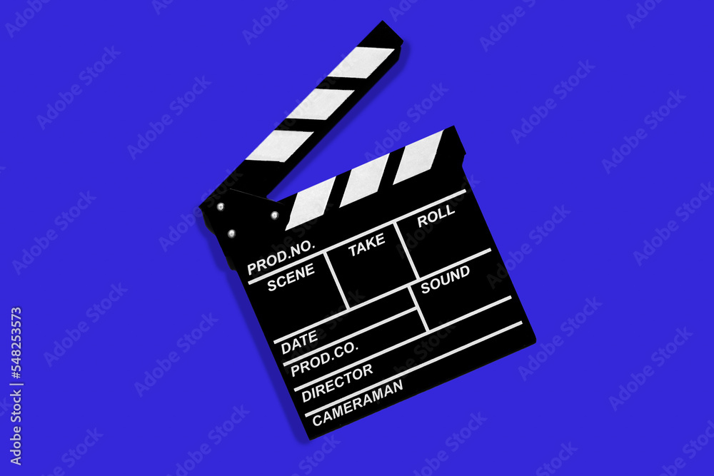 Clapperboard for shooting video footage takes on a blue background