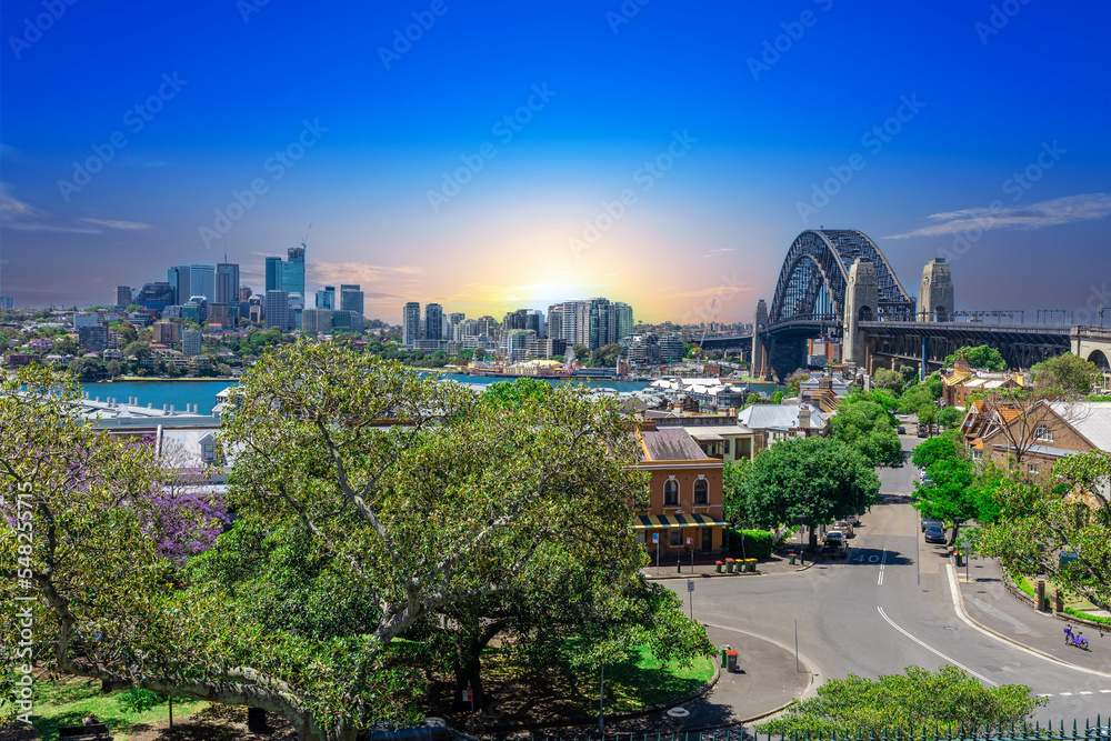 Fototapeta premium Sydney Harbour viewed from Observatory Park and overlooking Sydney Rocks area and North Sydney with colourful skies NSW Australia