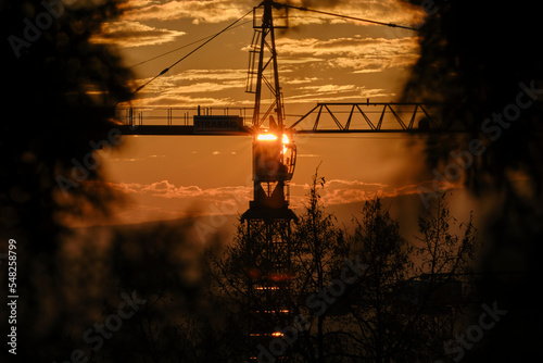 Energy from the sun - solar crane - Fire crane in the sunset