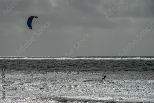 kite surfer in the sea on a stormy autumn day