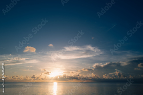 Sunset on sea. Beach sunrise with cloudy sky. Caribbean sea.
