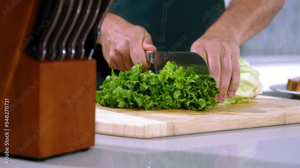 chef cuts the salad slow motion, chief make salad, slice the salad close-up chef cuts the salad slow motion, chief make salad, slice the salad close-up