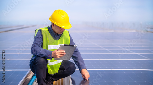 Wallpaper Mural Asian Engineer checking solar power cell energy on rooftop of factory. Torontodigital.ca