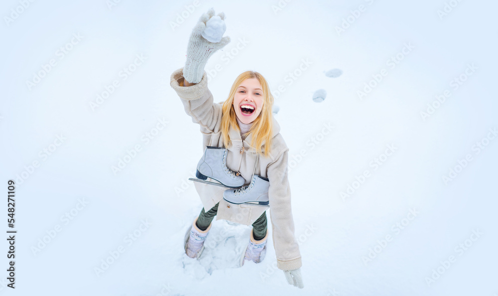 Girl throws snowballs. Snow games. Funny winter girl play with snow. Happy amazed girl in the snow make snowball. Winter activities in cold winter weather. Young girl laughing in snowy park. Girl throws snowballs. Snow games. Funny winter girl play with snow. Happy amazed girl in the snow make snowball. Winter activities in cold winter weather. Young girl laughing in snowy park.