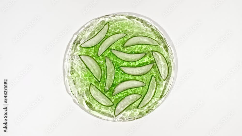 Eco friendly products on white background with green Aloe vera. Gel, fluid, collagen serum, essential oil. Natural organic skin care eco-cosmetics. flat lay. High quality 4k footage