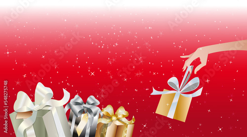Bannière groupes de cadeaux sur fond rouge étoilé horizontal avec  main qui saisi un cadeau photo
