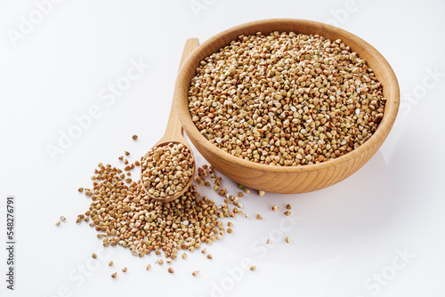organic raw green buckwheat on a white background