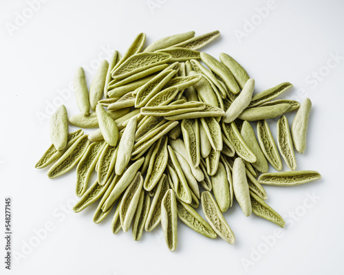 raw green cavatelli pasta on a white background