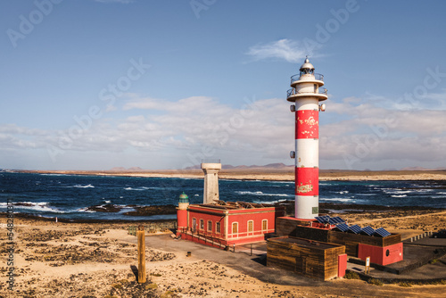 lighthouse on the coast of the sea photo