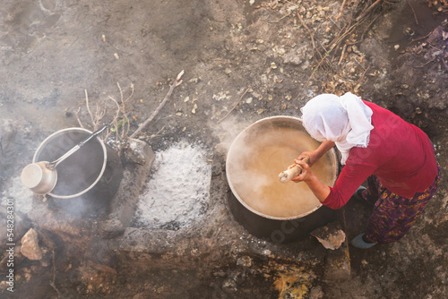 Making Orcik (cevizli sujuk) on the fire