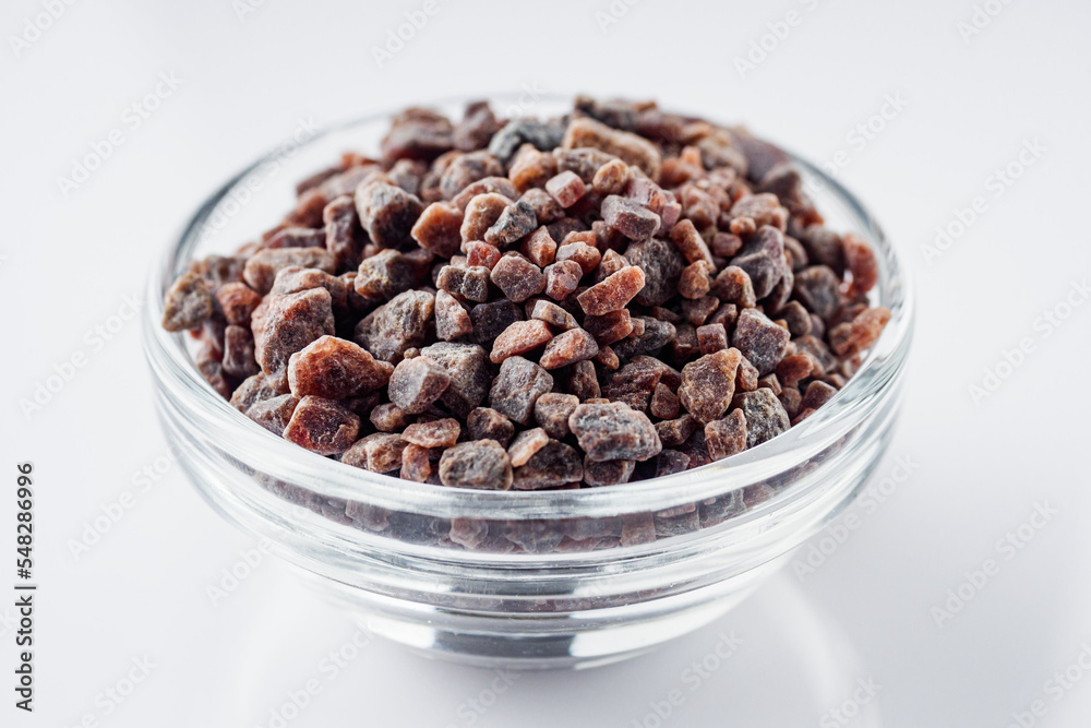 crystalline black Himalayan salt on a white background
