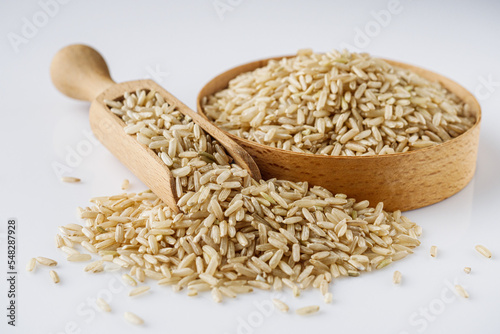 Obraz na plátně raw unpolished rice on a white acrylic background