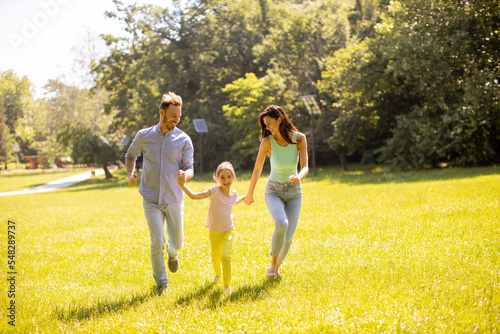 Happy young family with cut...