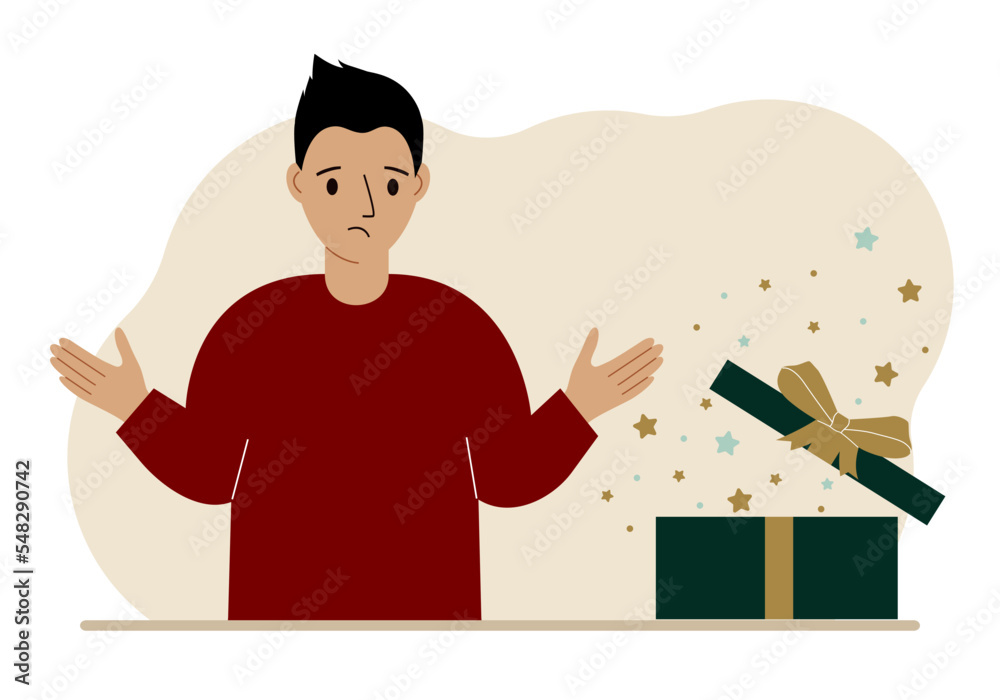 A man next to an open gift. The concept of a holiday, surprise, promotion, discount.