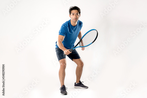 Male tennis player playing tennis with striving for victory gesture. © Naypong Studio