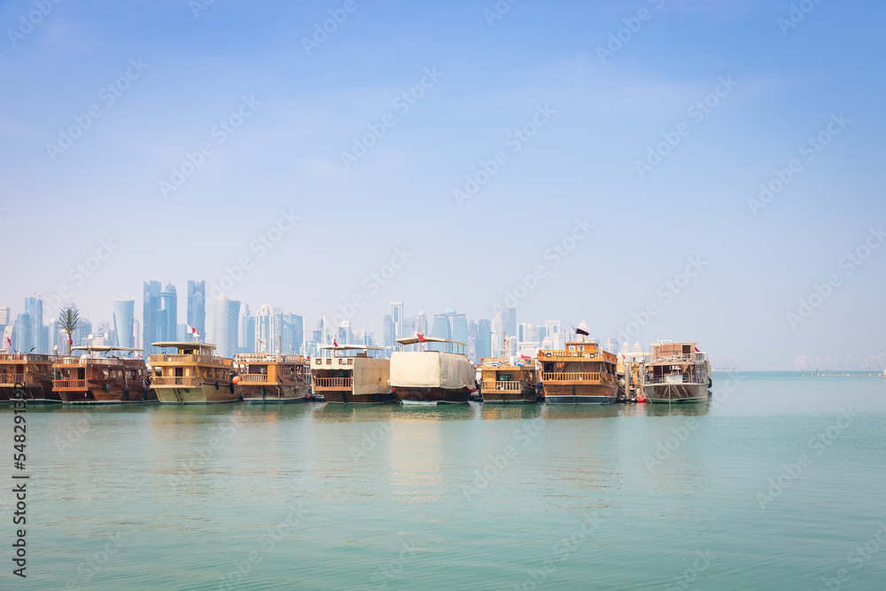 Traditional dhow boats docked in Doha, Qatar.