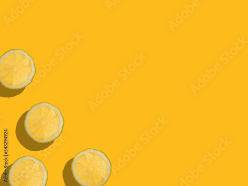 Lemon slices on a yellow background