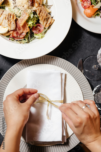 Decorating the festive table. Serving plates and glasses.
