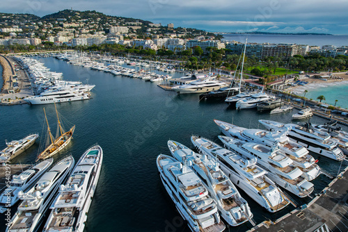 Aerial view of the marina of Cannes full of Yachts with la Croisette and La Plage Du Festival in the background © Mike Workman