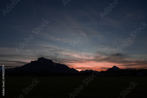 The relief of the Alpine mountains in a bright pink sunset in the vicinity of Salzburg  Austria