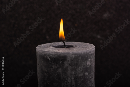  candle on a black background