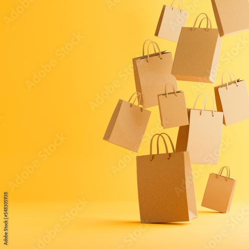 Flying paper shopping bags for black friday sale. 3d rendering