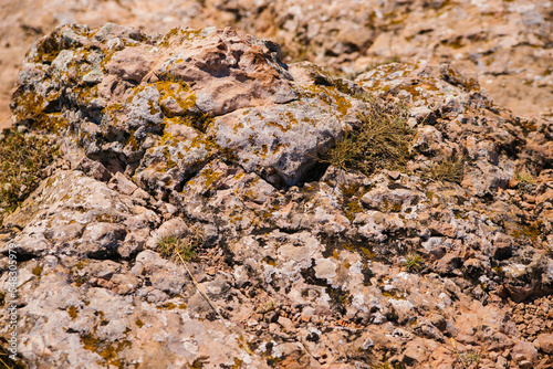 The texture of the stone. Abstract background. Uneven rough stones. Rock  mineral.