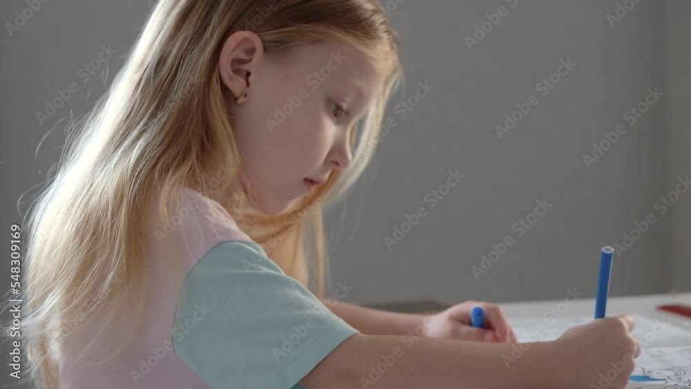 Blonde kid girl school pupil studying online from home watching web art class lesson or listening tutor by video call elearning on pandemic isolation. Children remote education Blonde kid girl school pupil studying online from home watching web art class lesson or listening tutor by video call elearning on pandemic isolation. Children remote education