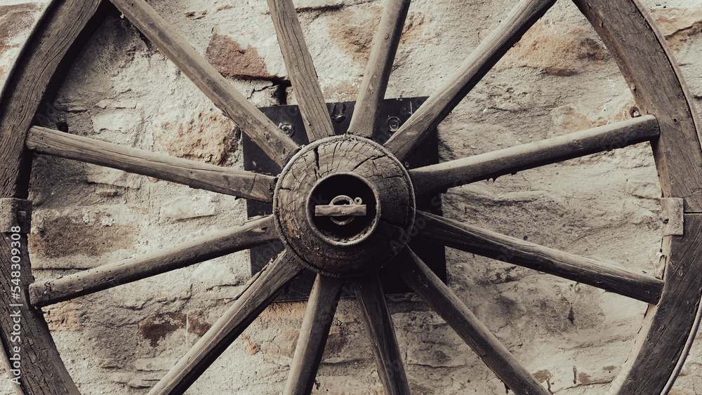close up of an old Wooden Carriage Wagon Wheel 