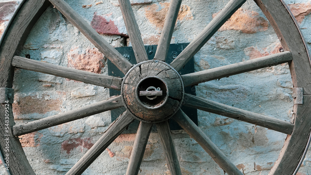 close up of an old Wooden Carriage Wagon Wheel 