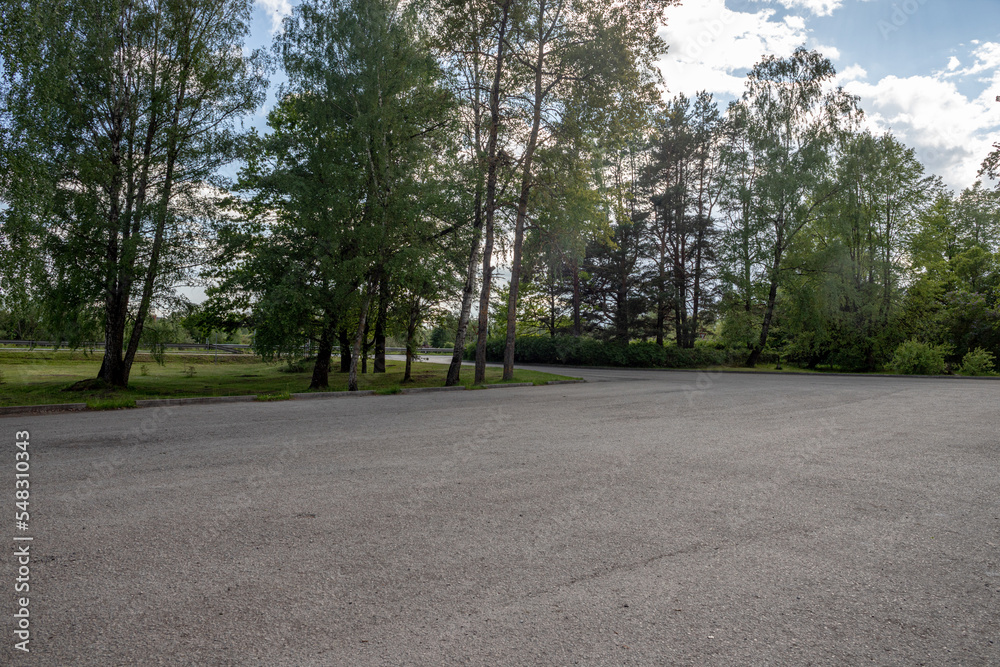 big square with asphalt green trees