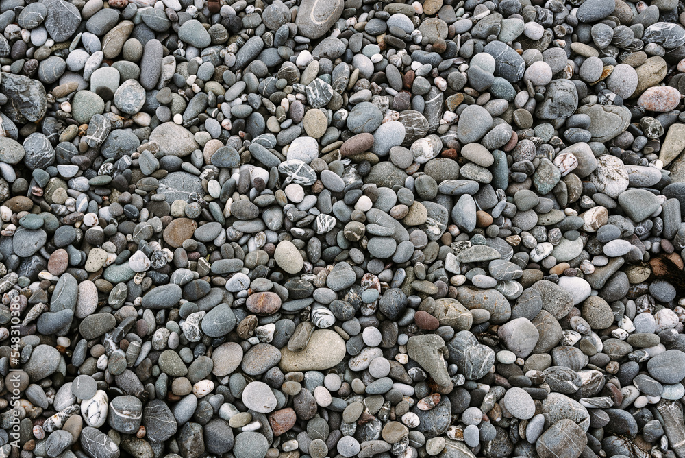 Abstract background with black and gray round sea pebble stones Abstract background with black and gray round sea pebble stones