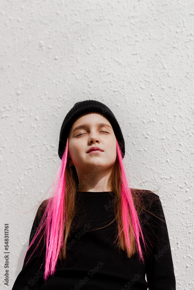 Fototapeta premium Beautiful teenage girl wear black beanie posing in city.