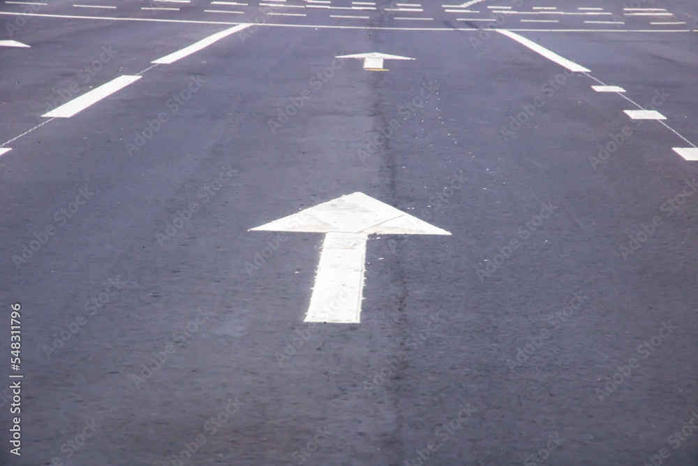 Markings on the road arrow forward closeup Markings on the road arrow forward closeup