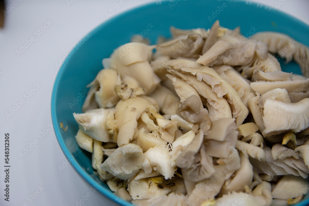 Oyster mushroom, sliced in a bowl Oyster mushroom, sliced in a bowl