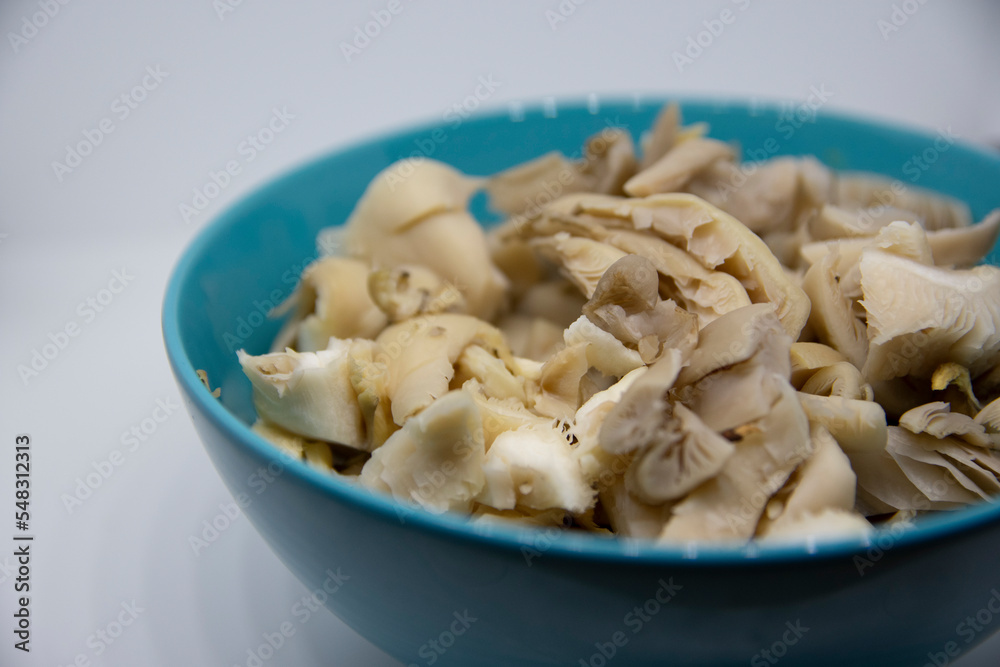 Oyster mushroom, sliced in a bowl Oyster mushroom, sliced in a bowl