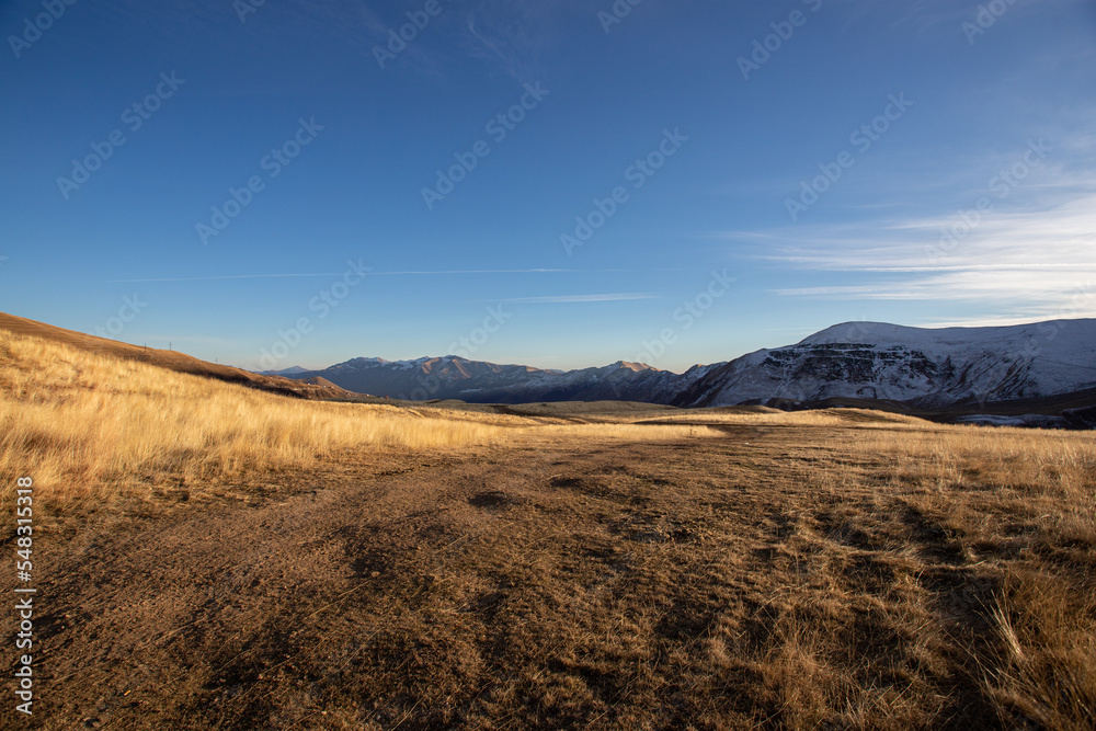 earth and dry yellow grass in the mountains