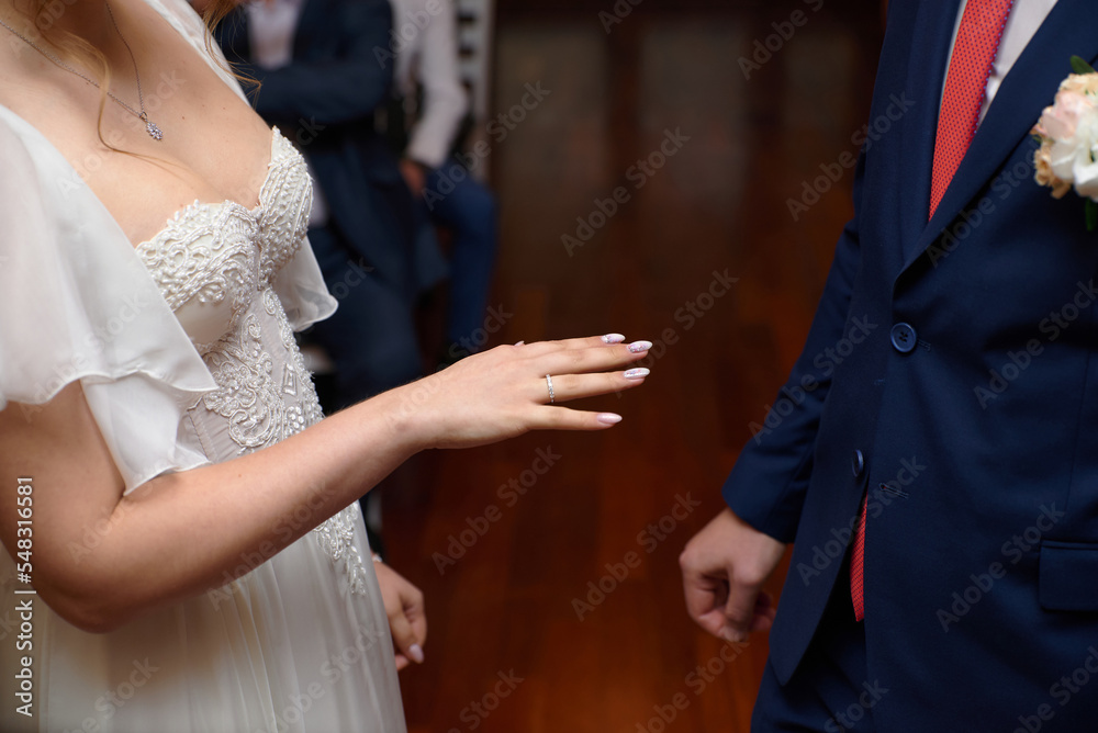 Wedding rings on hands close-up