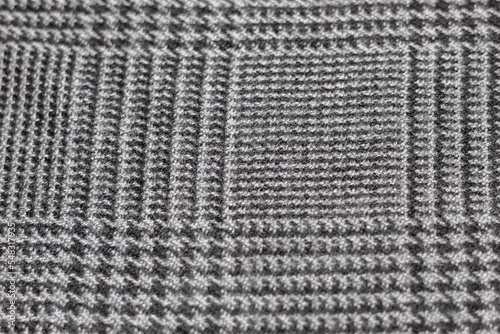 Close up to a checkered wool fabric