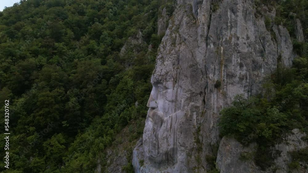 Aerial video of the statue of Decebal, located on the gorges of Danube river in Romania. Video was shoot from a drone with camera lowered with the statue in the view. Aerial video of the statue of Decebal, located on the gorges of Danube river in Romania. Video was shoot from a drone with camera lowered with the statue in the view.