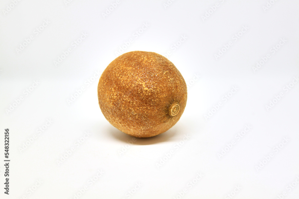 Single dry lemon on white background. Selective focus Single dry lemon on white background. Selective focus